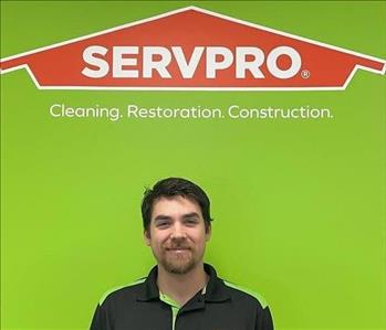 Tyler with Servpro background