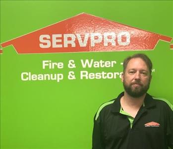 Male employee Nick K with a green SERVPRO background