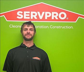 Kory with servpro green background