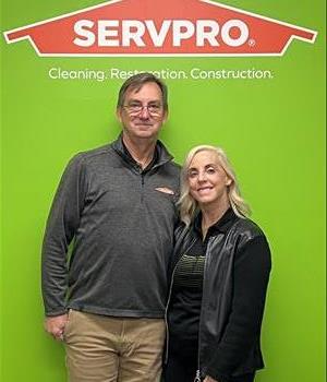 terry and jnene with servpro background
