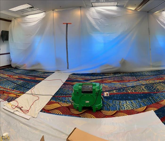 meeting room colorful carpet, plastic sheet containment barrier ceiling to floor
